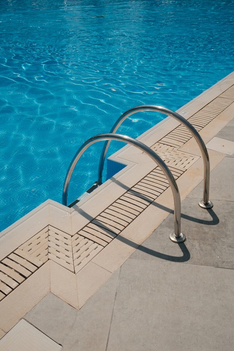 Pool steps invite you to a refreshing swim.